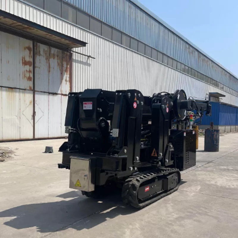 A custom-made black spider crane with a cantilever arm, a miniature crane capable of lifting trees.